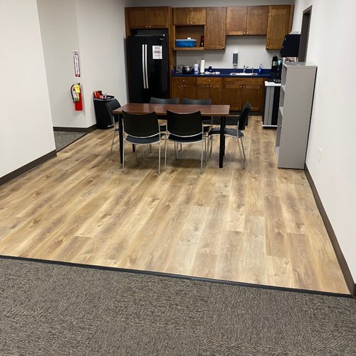 Office lunch room with carpet tile and LVP floors