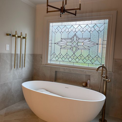 Modern bathroom with a feature leaded glass window