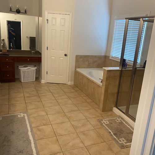 Bathroom with outdated brown tiles
