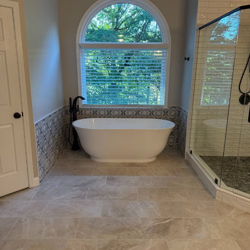 New tile flooring in a remodeled bathroom by Bridgeport Carpets