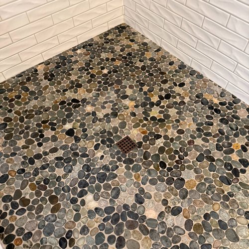 Pebble shower floor installed by Bridgeport Carpets