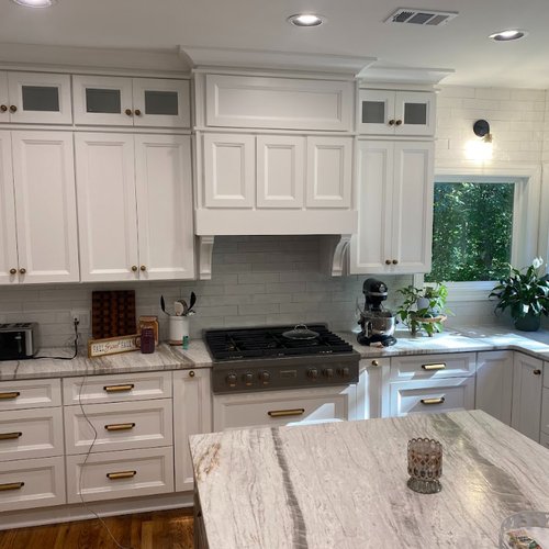 White kitchen cabinets and subway tile backsplash