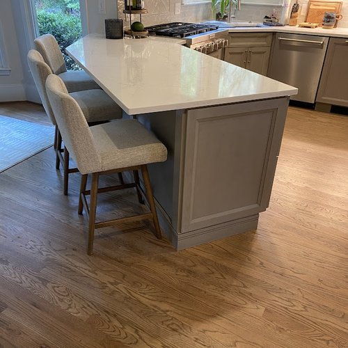 Kitchen bar stools at an island with marble countertop