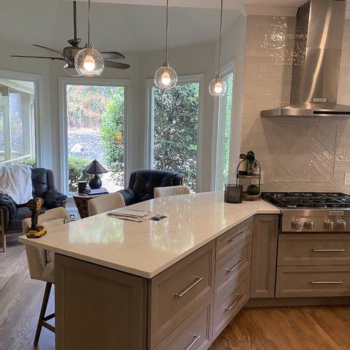 Pendant light fixtures in a new kitchen remodel by Bridgeport Carpets