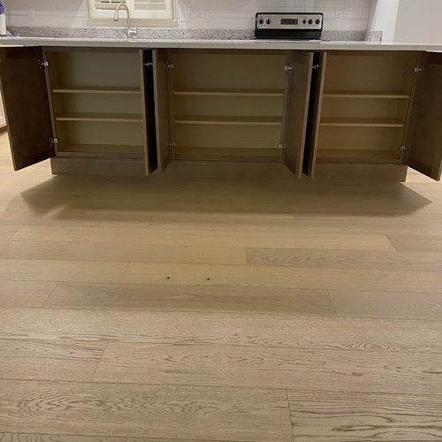 Kitchen cabinets on an island by Bridgeport Carpets