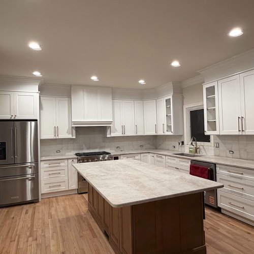 White cabinets with a neutral granite countertop