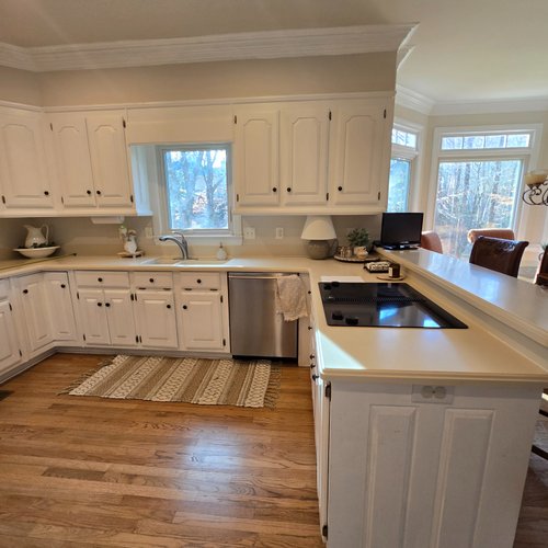 Outdated kitchen with old laminate flooring