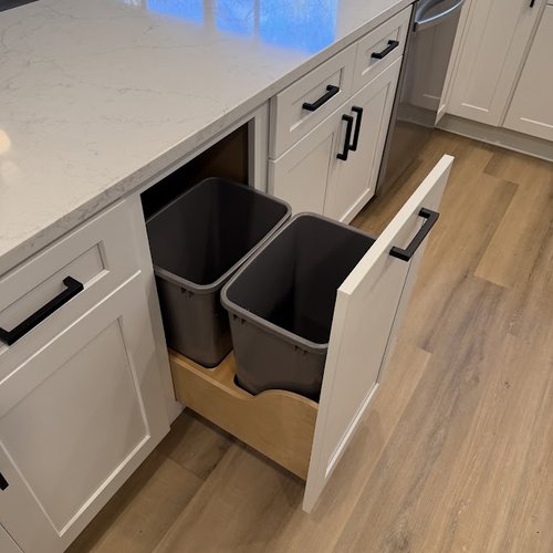 Pull out garbage drawer in a modern kitchen remodel