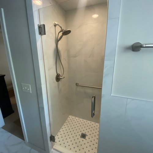 Shower in an Alpharetta bathroom with patterned tile