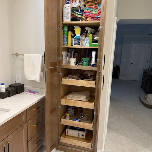 Storage cabinet in a bathroom updated by Bridgeport Carpets & Flooring