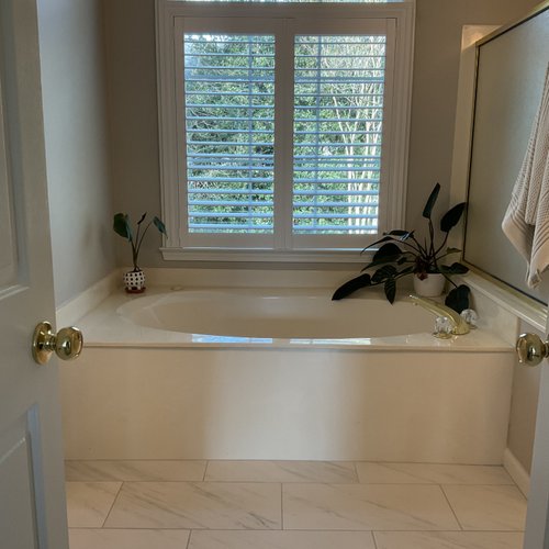 1980s style bathtub with brass hardware