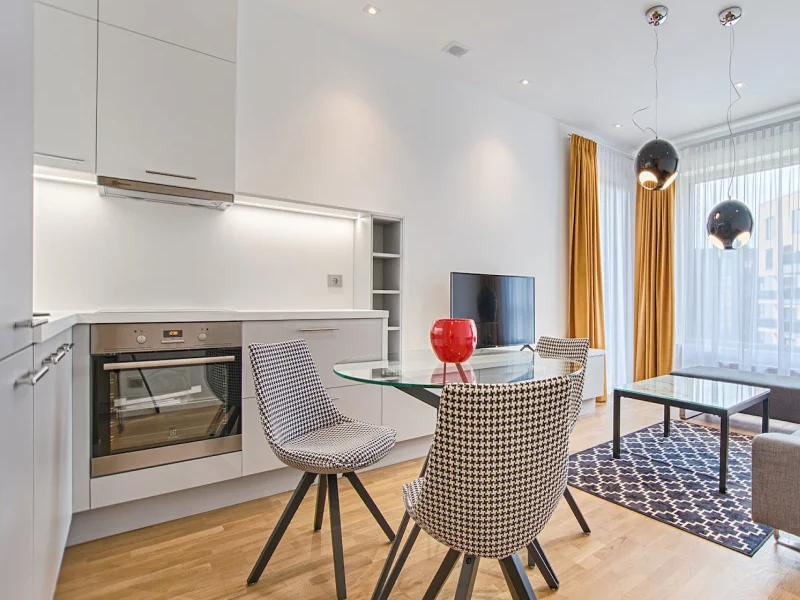 Bright kitchen with light warm laminate flooring