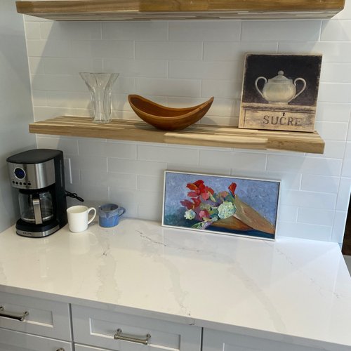 Stylish kitchen counters in marble and white subway tile backsplash