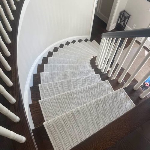 Beautiful carpet stair runners on a spiral staircase