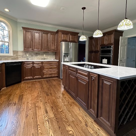 White shaker kitchen remodel wood floor with island
