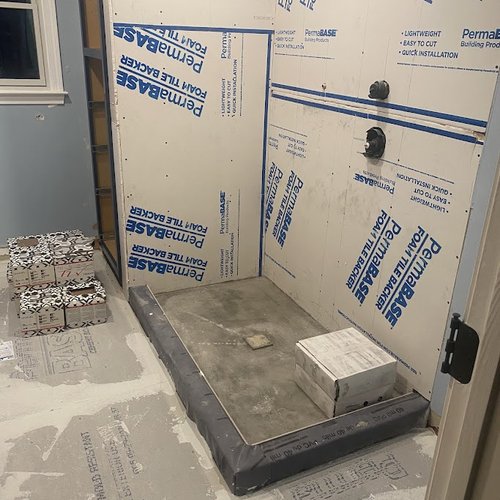 Shower wall installation in progress by Bridgeport Carpets & Flooring