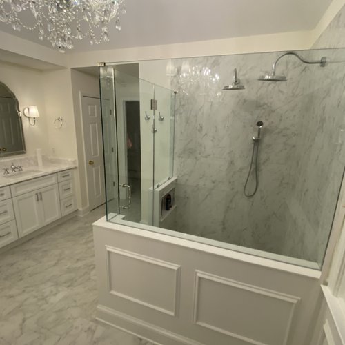 Alparetta Bathroom with marble tiles and a chandelier
