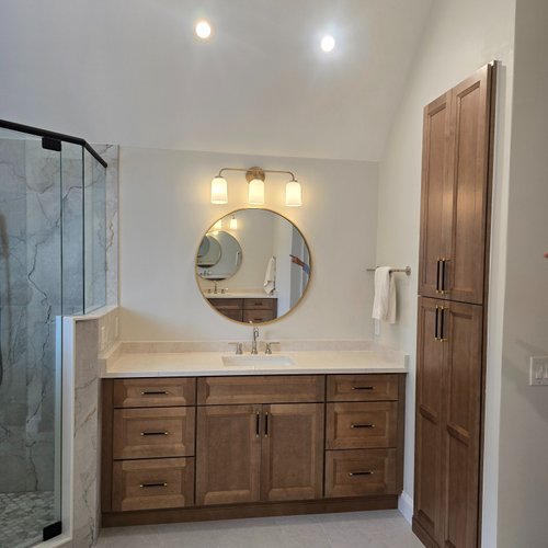 New bathroom vanity with brown wood cabinets
