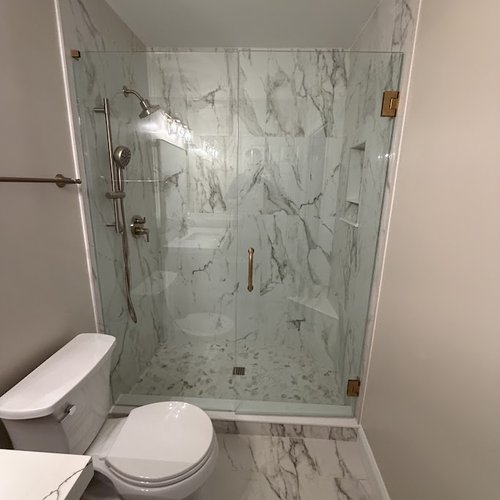 Grey and white marbled shower tile wall installed in Alpharetta, GA