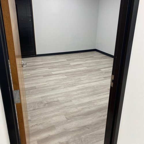 Light brown LVP flooring in an empty office in GA
