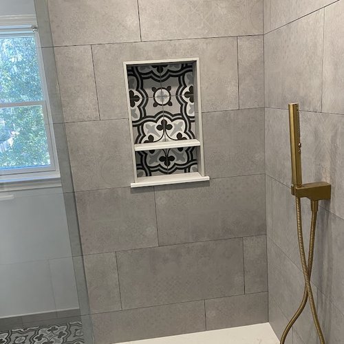 Mosaic tile feature in a modern shower