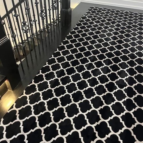 Black and white style carpet on a stair landing