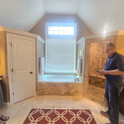 Bridgeport Carpets & Flooring discussing a bathroom remodel