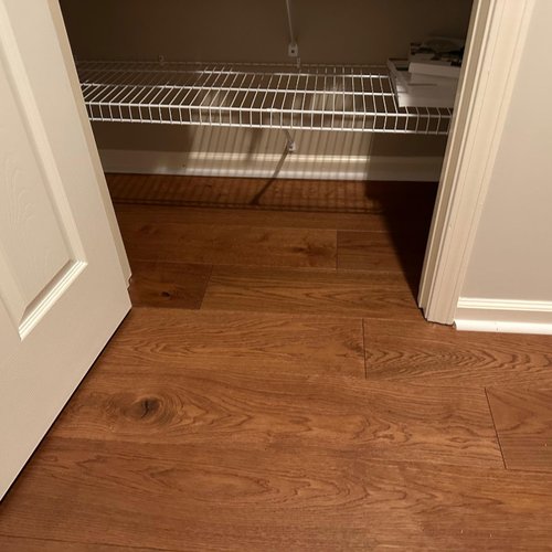 Closet space with wood floors installed by Bridgeport Carpets