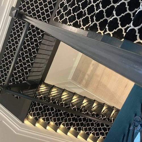 Black and white patterned carpet stair runner