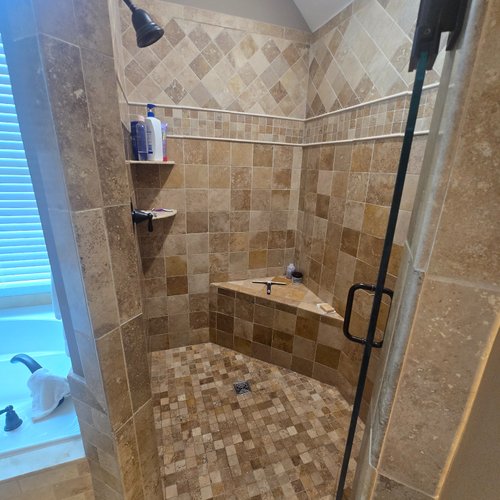 Pre Bathroom Remodel example with old brown shower tiles