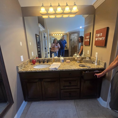 Bathroom vanity with brown cabinets
