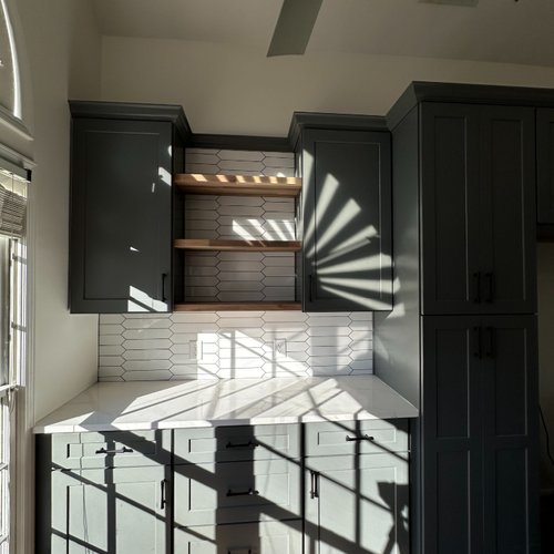 Kitchen cabinets with sunlight streaming through window in Alpharetta GA
