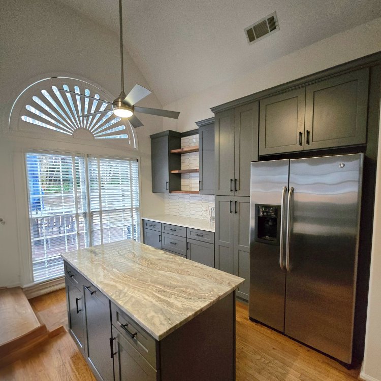 Kitchen with grey cabinetry and wood floors