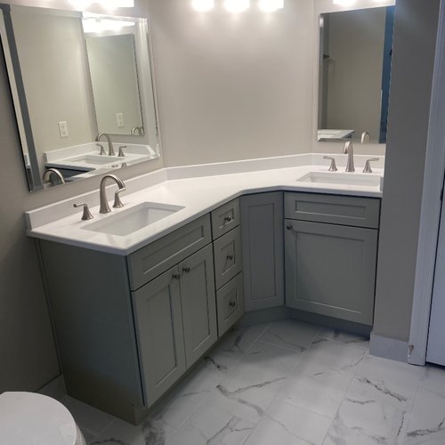 Grey bathroom cabinets and marble tile flooring in Georgia